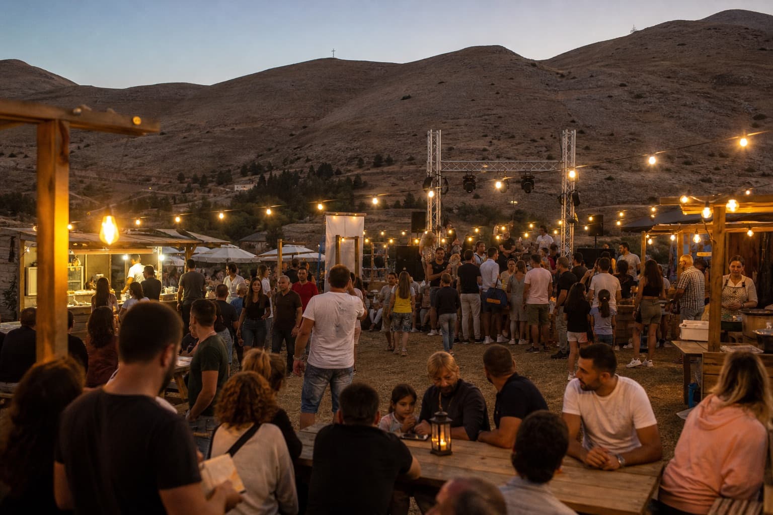 Evening gathering at a summer mountain festival near Faqra
