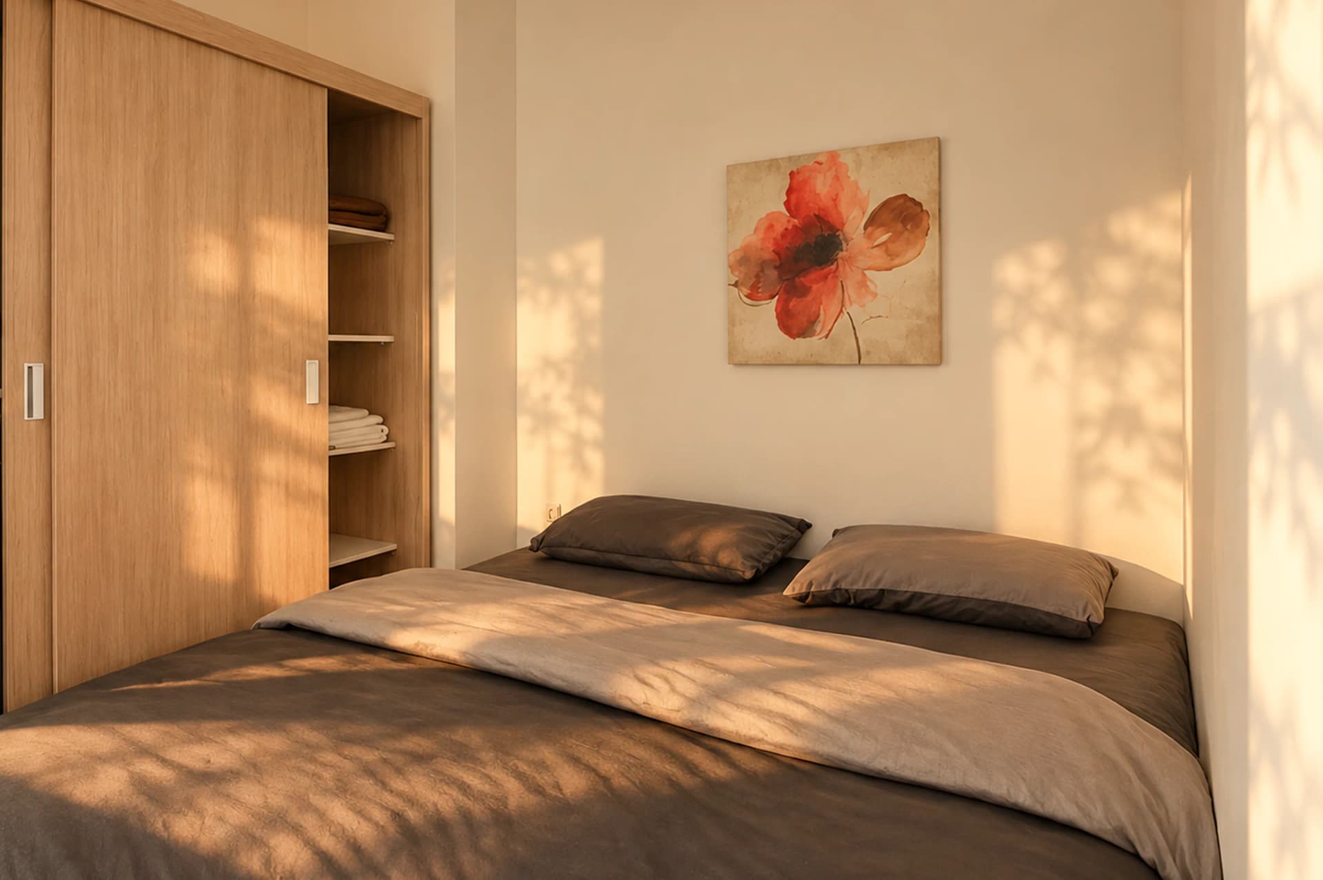 The sunlit bedroom waiting at The Nest, the king bed made