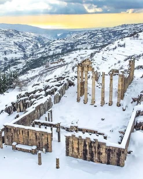 The Faqra temple ruins under snow, the valley below